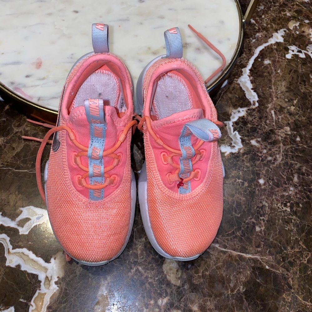 Little girl Nike sneakers.